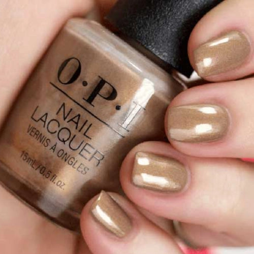OPI Fall-ing for Milan Neutral/Nude Sandy Brown with Gold Shimmer Nail Polish from the OPI Muse of Milan Collection. OPI Item Product Code NLMI01