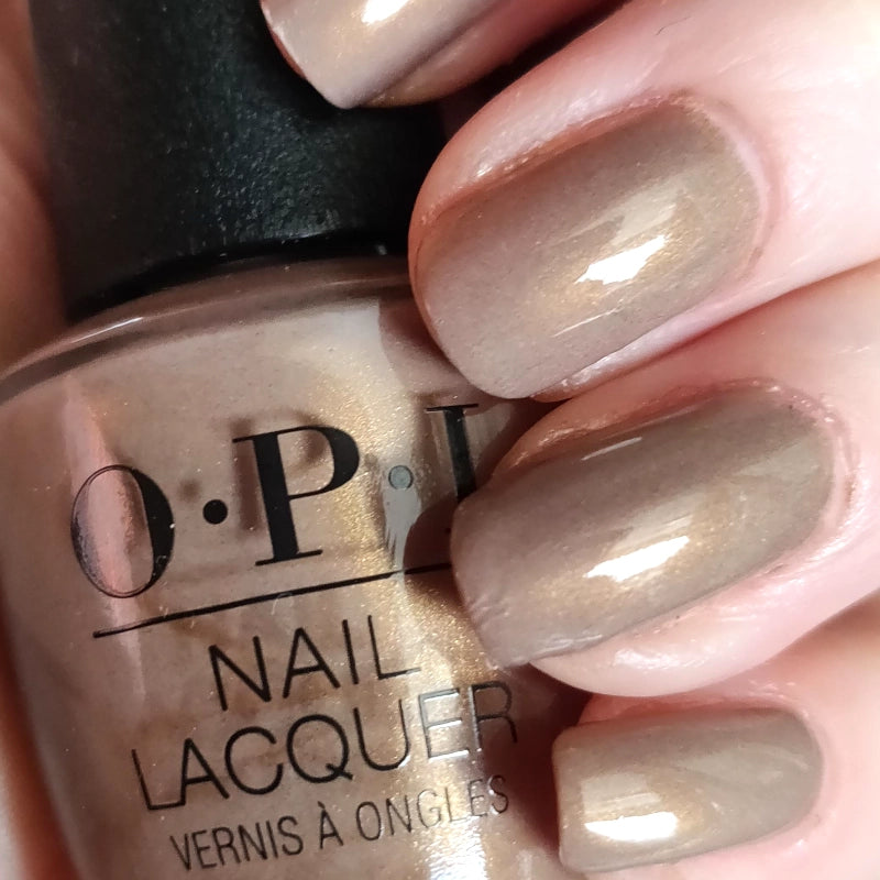 OPI Fall-ing for Milan Neutral/Nude Sandy Brown with Gold Shimmer Nail Polish from the OPI Muse of Milan Collection. OPI Item Product Code NLMI01