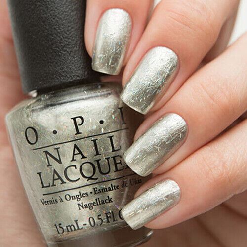 OPI Is This Star Taken? Soft Pale Gold Nail Polish with Holographic Bar Glitter from the OPI Starlight Collection. OPI Item Product Code HRG43