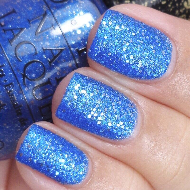 OPI Kiss Me At Midnight Blue Glitter Liquid Sand Nail Polish from the OPI x Mariah Carey Holiday Collection. OPI Product Code HLE22