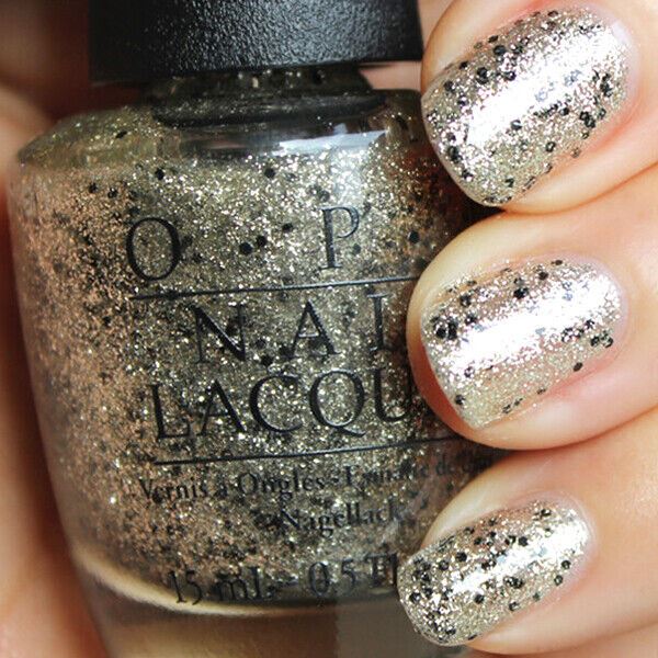 OPI Wonderous Star Gold and Black Glitter Nail Polish from the OPI x Mariah Carey Collection. OPI Product Code HLE12