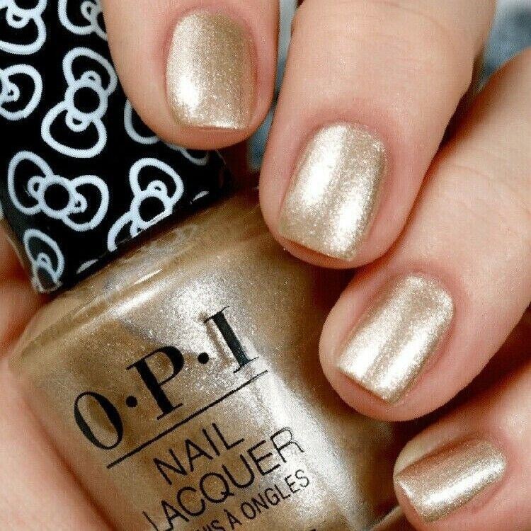 OPI Many Celebrations To Go! Gold Shimmer Nail Polish from the OPI x Hello Kitty Collection. OPI Item Product Code HRL10