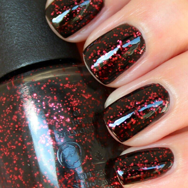 OPI Today I Accomplished Zero Red Pink Glitter in a jelly semi-sheer black base. This OPI Nail Polish is from the Coca-Cola Collection